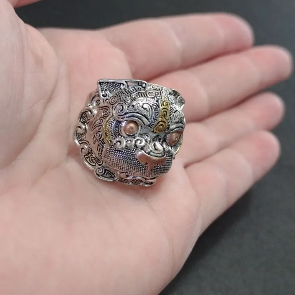 Silver tone ring looks like a tribal animal size 7